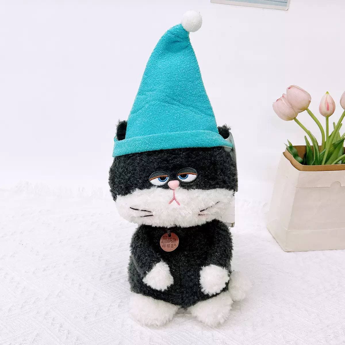 Игрушка «Сердитый кот» в синей шапке, 30 см